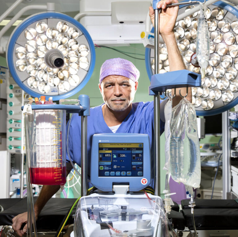 Dr. Dave R Koolbergen in an operating room with surgical equipment
